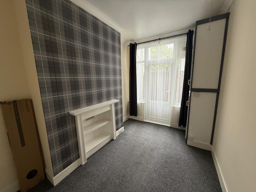 Lot: 155 - ONE-BEDROOM GROUND FLOOR FLAT - Bedroom with access to small outside space